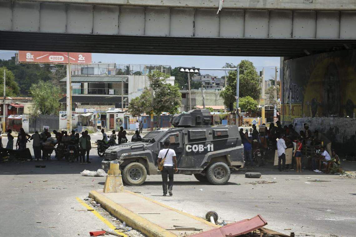 Residents of the Delmas neighborhood, who were forced to flee their homes by armed gangs, tour the destruction on Thursday, Aug. 28, 2025 after spokesman for the Viv Ansanm gang coalition, Jimmy “Barbecue” Chérizier, invited residents to return home.