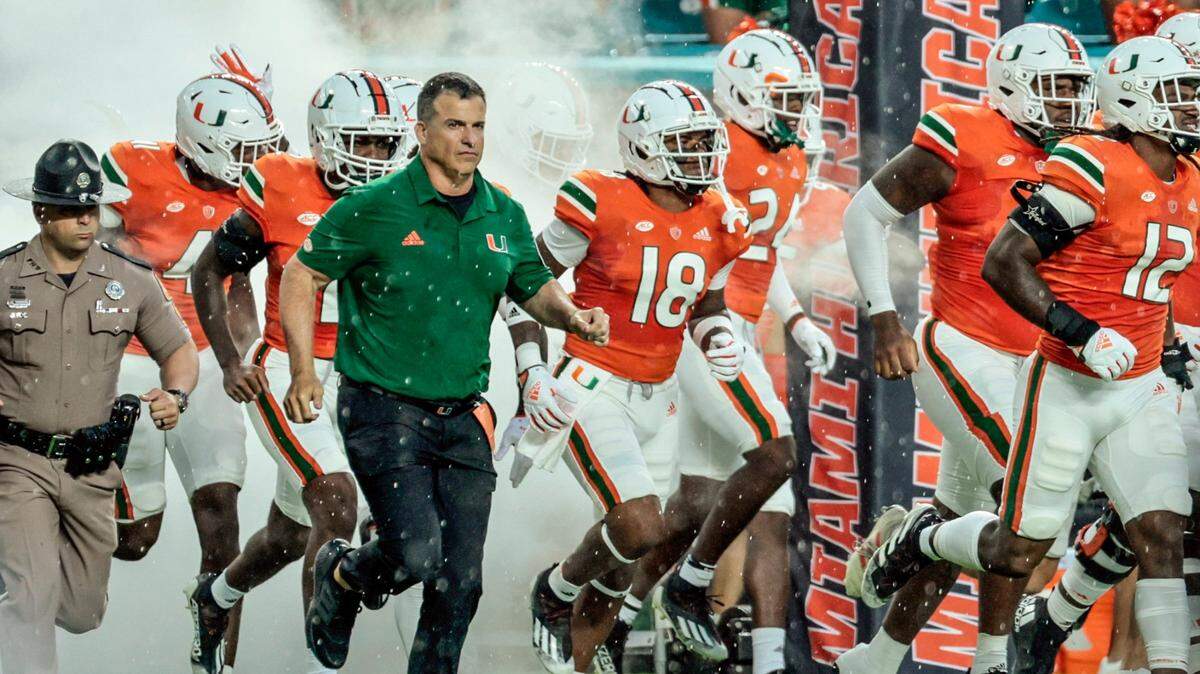 Miami Hurricanes head coach Mario Cristobal rushes the field before the start of game against Middle Tennessee State Blue Raiders at Hard Rock Stadium in Miami Gardens on Saturday, September 24, 2022.
