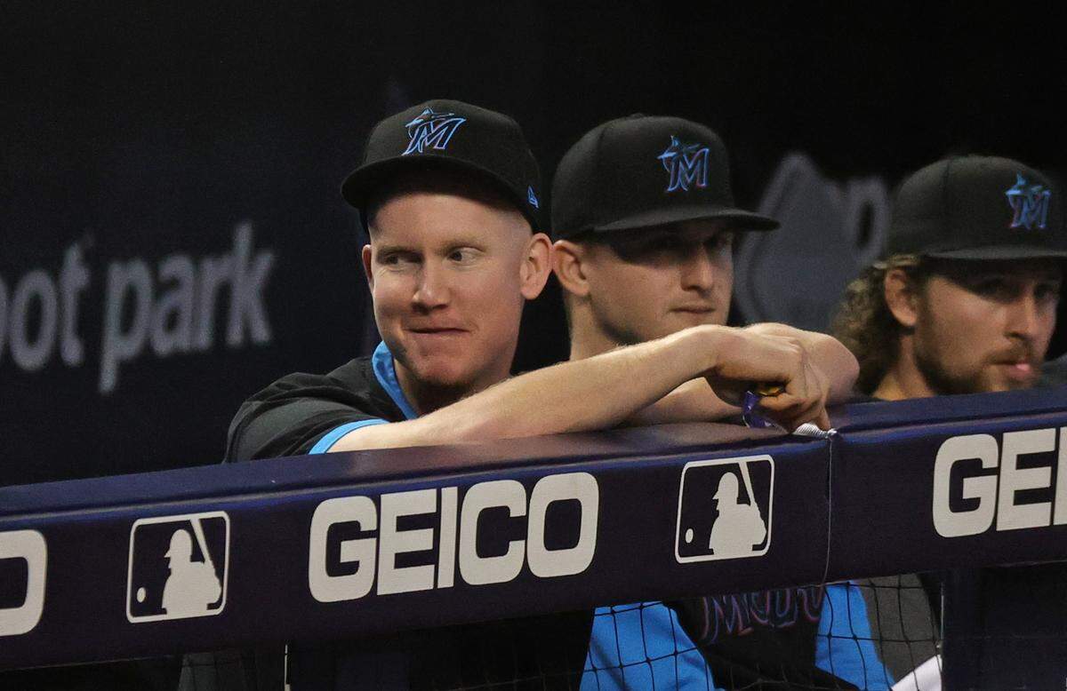 Miami Marlins right fielder Garrett Cooper (26) looks from the dugout during the second inning of their baseball game against the Colorado Rockies at loanDepot park on Thursday, June 10, 2021 in Miami, Florida.