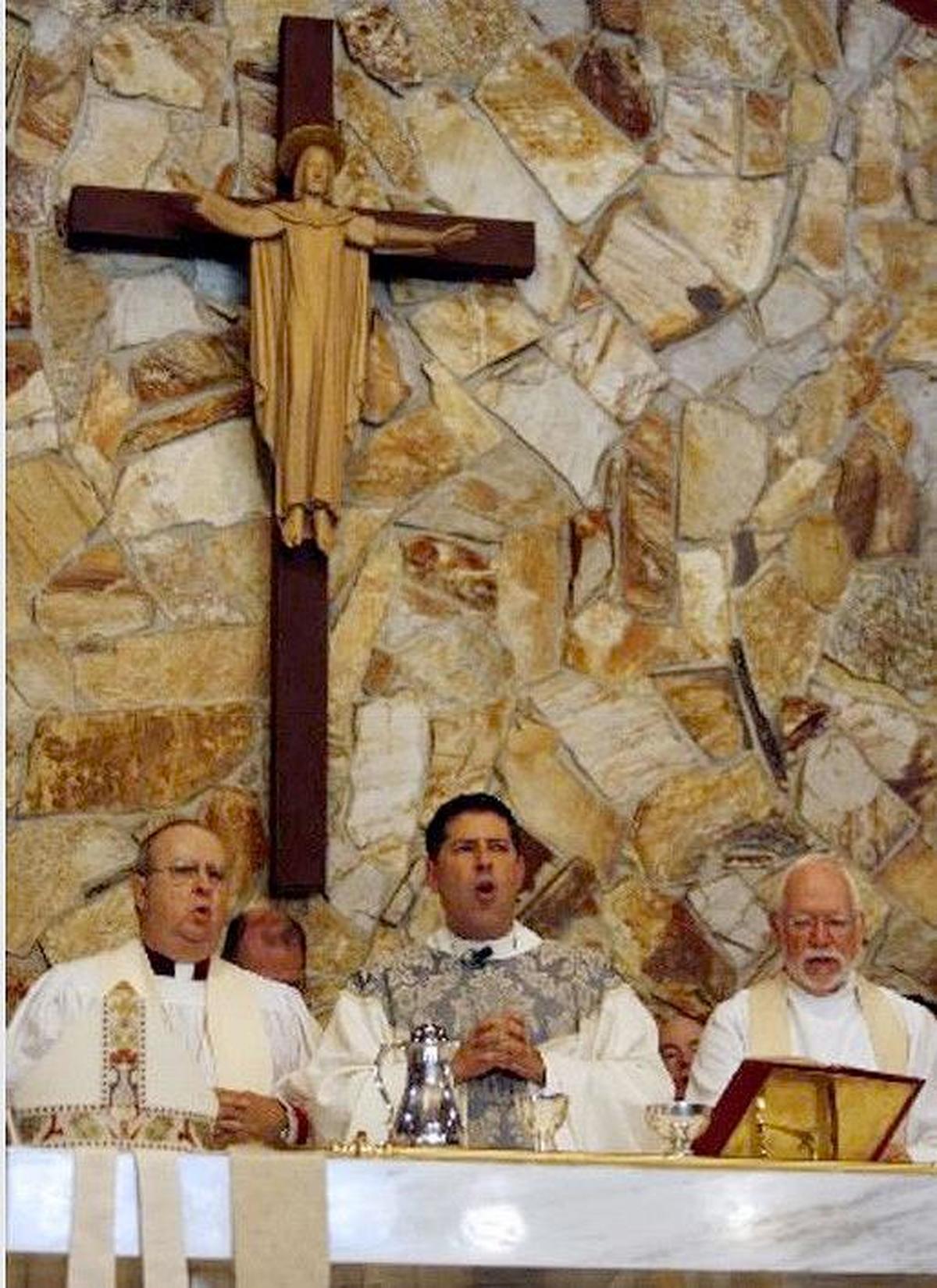The Rev. Alberto Cutie, center, along with Bishop Leo Frade, then the bishop of the Episcopal Diocese of Southeast Florida, left, and the Rev. Howard Stowe, right, during the ceremony where Cutie was received as an Episcopal priest at the Church of Resurrection in Biscayne Park on May 29, 2010. Stowe will celebrate the 50th anniversary of his ordination as an Episcopal priest at 10:30 a.m. Sunday at Saint Stephen’s Episcopal Church in Coconut Grove.