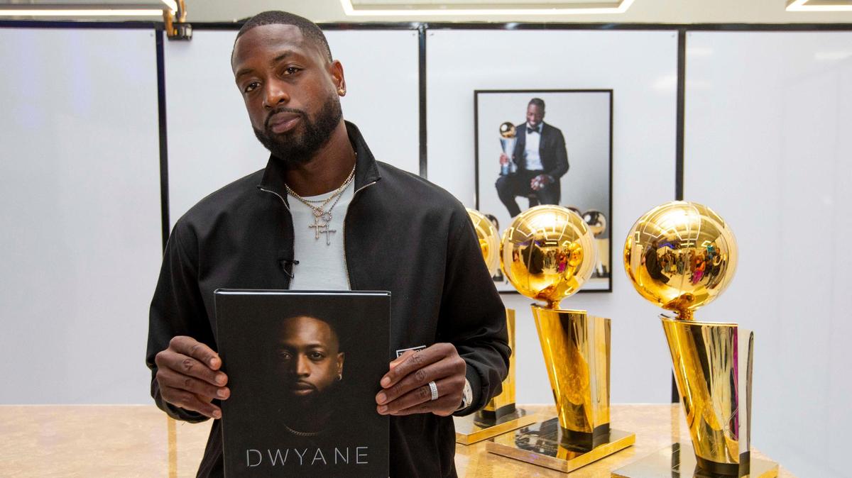 Miami Heat legend Dwyane Wade speaks to an audience during a moderated discussion for his new memoir “Dwyane.” at The Shop in Pop Up Shop Miami in the Wynwood neighborhood of Miami, Florida, on Friday, November 19, 2021.