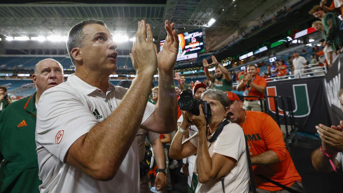 Miami Hurricanes head coach Mario Cristobal celebrates with fans after the Canes defeat the Florida A&M Rattlers at Hard Rock Stadium in Miami Gardens, Florida, on Saturday, September 7, 2024.