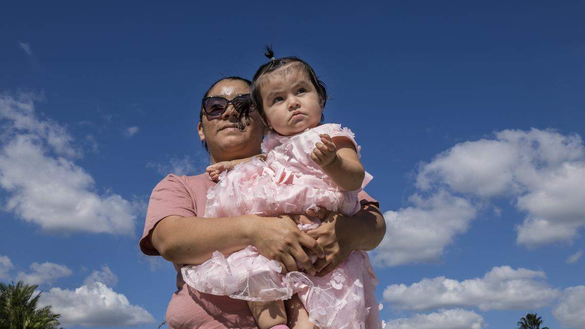 Farmer worker Leyla Ac Choc, of Guatemala posed with her daughter Melany Reynoso, 14.m.o, as she talks about her financial hardship and change in living situation after her husband was deported, leaving her as the sole family provider. In Homestead on Saturday, November 15, 2025.