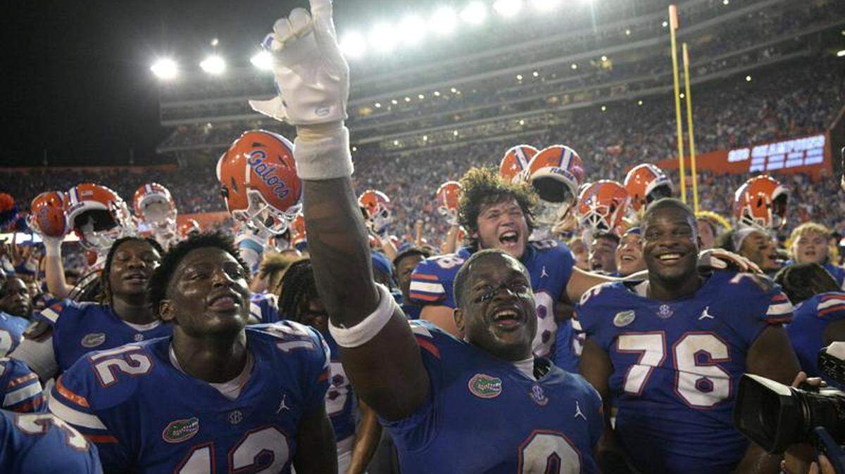 The University of Florida football team celebrates its 29-26 upset over No. 7 Utah, a win that catapulted the previously unranked Gators to No. 12 in the AP Top 25 on Sept. 6, 2022.
