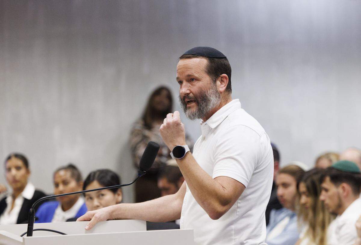 Adam Haston speaks in support of a mikvah, a Jewish ritual bathhouse, being built on a residential street during a Historic Preservation Board meeting on Tuesday, Dec. 9, 2025, at Hollywood City Hall in Hollywood, Fla. The board must decide whether to approve a mikvah, a Jewish bathhouse, being built on a residential street situated between single family homes. Haston says it is federally protected and thinks it will go to court if it is denied.