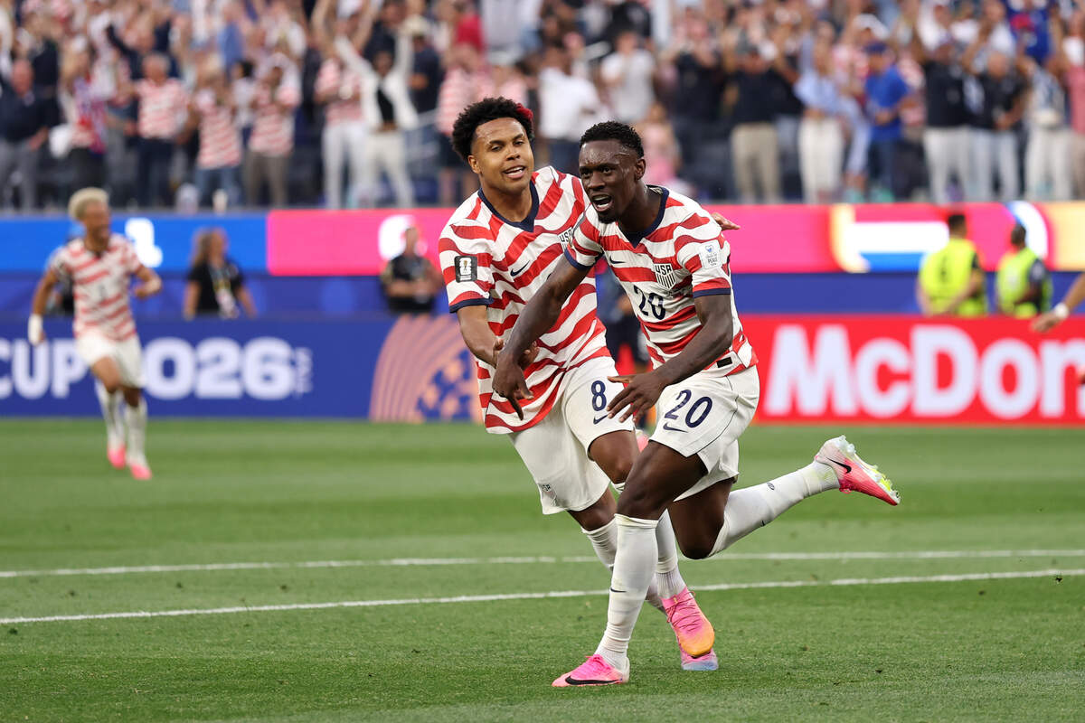 LOS ANGELES, CALIFORNIA - JUNE 12: Folarin Balogun #20 of the United States celebrates scoring his team's second goal with Weston McKennie #8 during the FIFA World Cup 2026 Group D match between USA and Paraguay at Los Angeles Stadium on June 12, 2026 in Los Angeles, California. (Photo by Richard Heathcote/Getty Images)