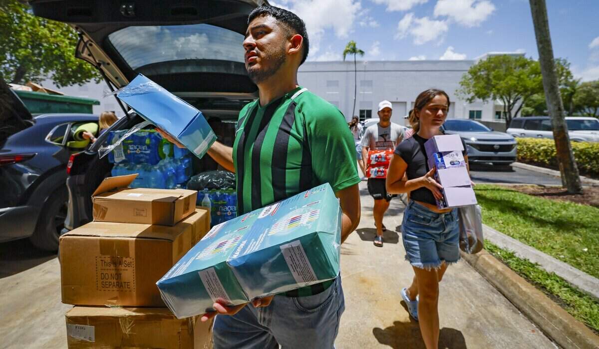 Guillermo Corado, and Sonsoles Lopez, deliver donations at Global Empowerment Mission.