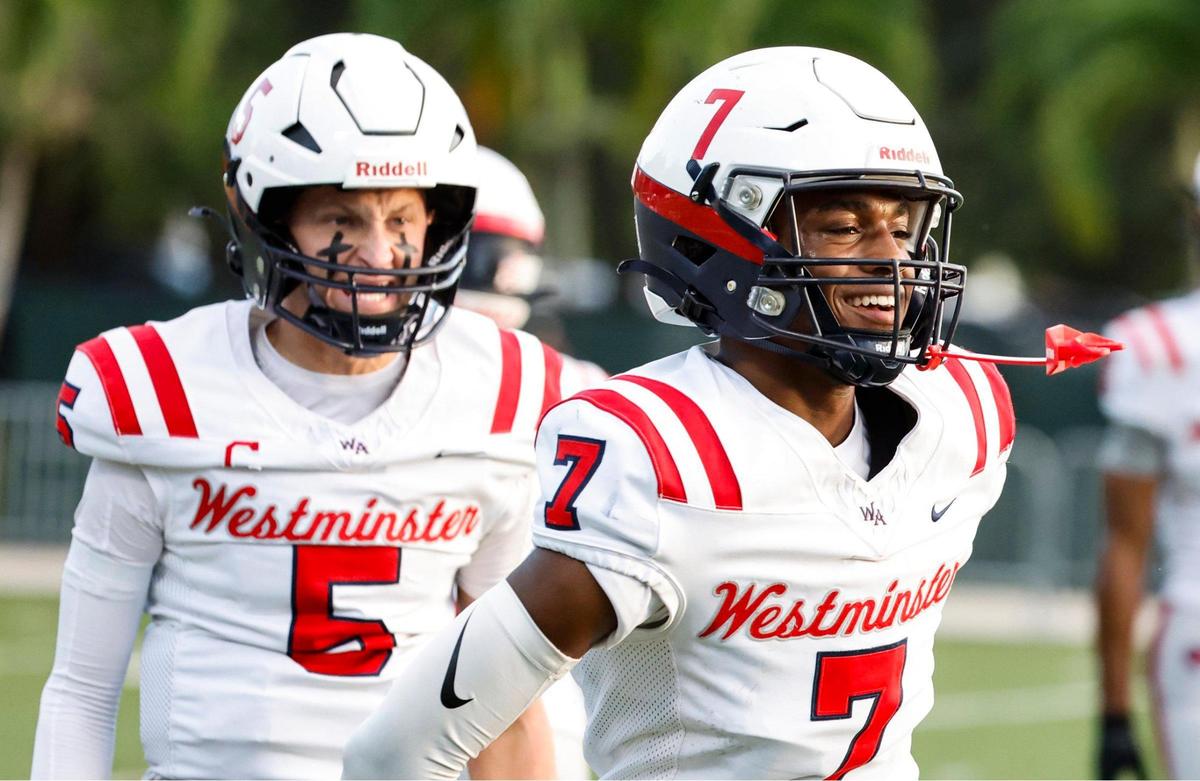Westminster High School’s quarterback Anthony Barber (5) and Amari Deer (7) react after Deer scores in the first half of the game against University School at AutoNation Field at University School campus in Davie, Fl. on Thursday, November 2, 2023.