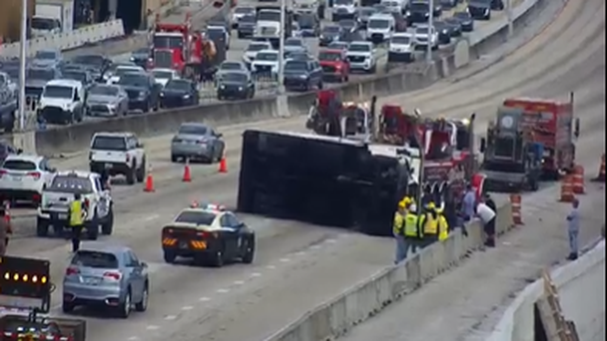 A large vehicle flipped on its side and blocked several northbound lanes of Interstate 95 near Hollywood, Florida, on the morning of Friday, Dec. 8, 2023.