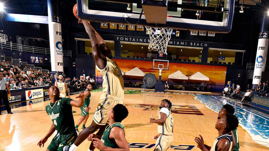 FIU’s Osasumwen Osaghae (34) goes for a dunk against USF., 73-82, at Ocean Bank Convocation Center, Miami, Florida.