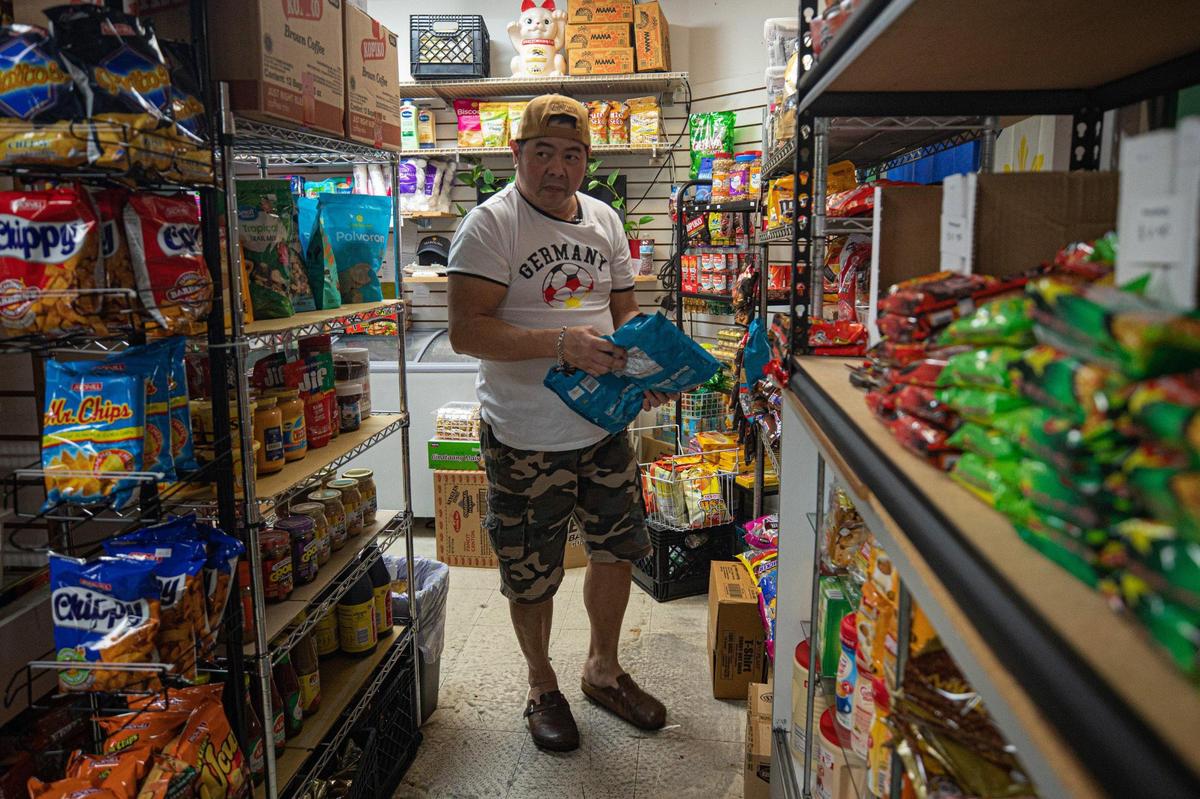 Royal Caribbean cook Melvin Reyes shops for American chocolate for a gift for his family at Filtrip Filipino Store in Miami, on Oct. 10, 2022.