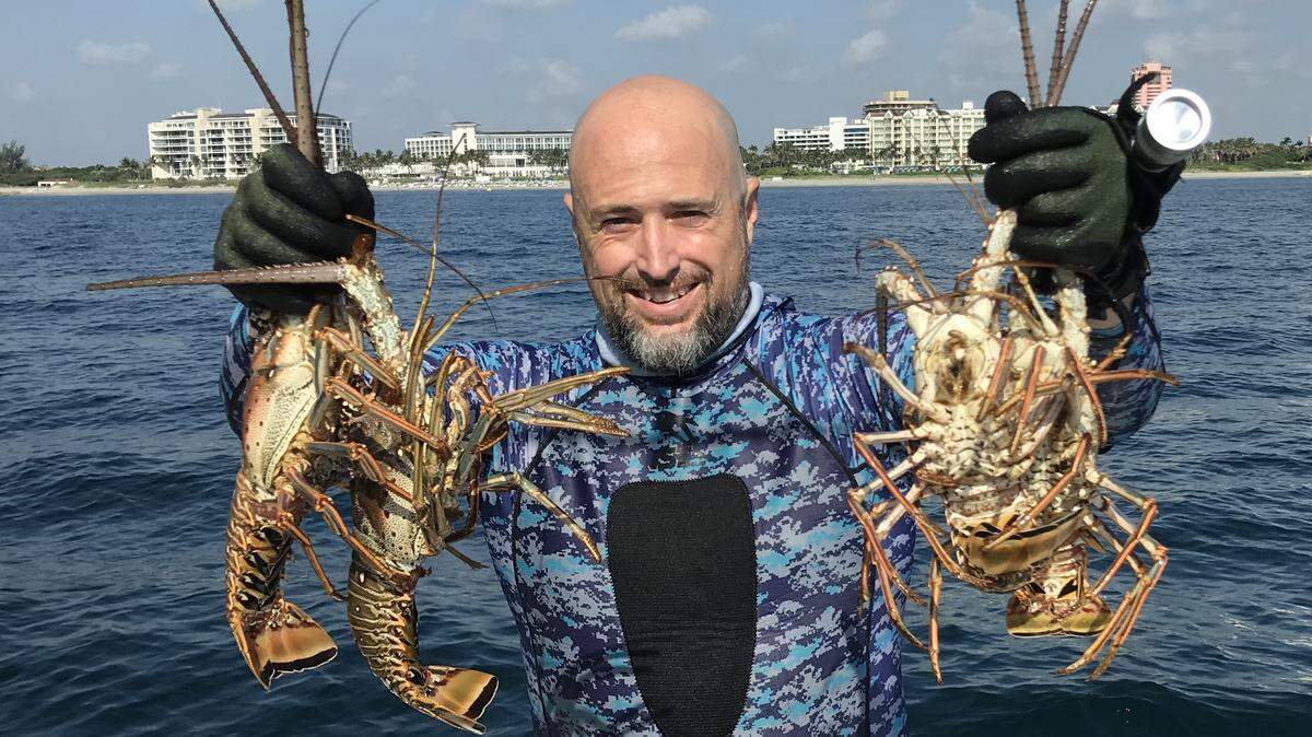 John Strunk of the Chiefy crew shows off some miniseason lobsters in July 2018.