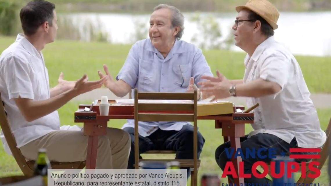 Vance Aloupis (on left), a candidate for the Republican primary in the Florida House District 115 race, is being criticized by Cuban-born political foe Jose Fernandez, also a candidate in the House race, for a TV commercial in which Aloupis — who is not Hispanic — wears a traditional Cuban guayabera and plays dominoes. Fernandez calls it “pandering.” Aloupis calls it connecting to the community.