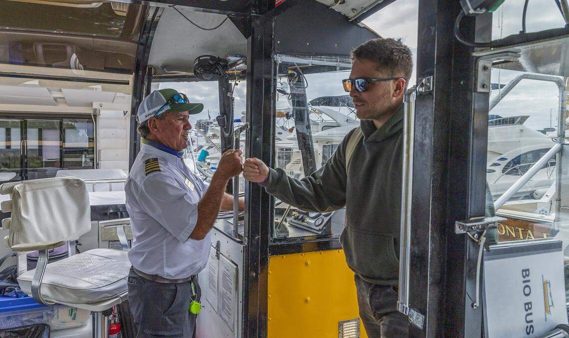 Captain Carlos Dominguez greets a passenger as he boards at the Venetian Marina and Yacht Club, a vessel part of the free water taxi service established last January, between the Maurice Gibb Memorial Park in Miami Beach and the Venetian Marina and Yacht Club at North Bayshore Drive on the Miami side of Biscayne Bay, on Wednesday, April 15, 2026.