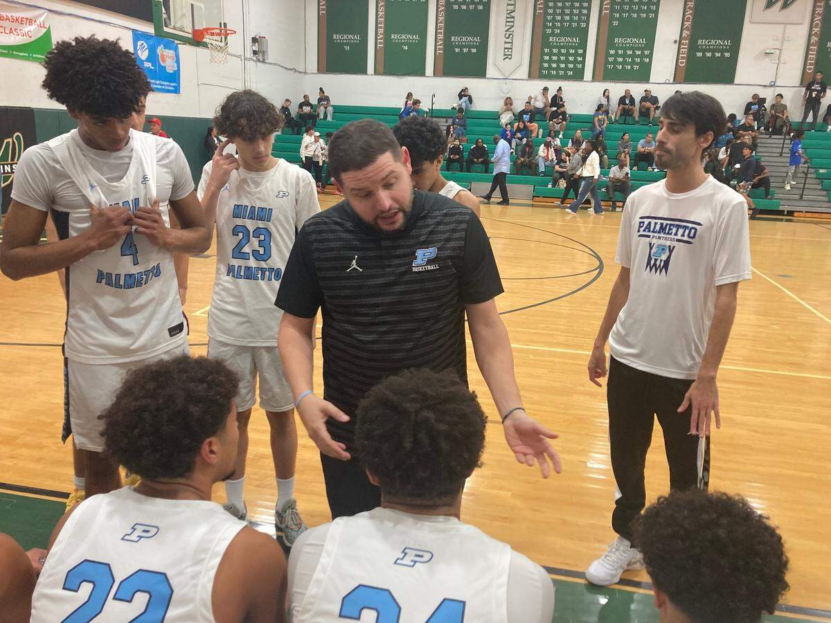 Miami Palmetto boys’ basketball coach Alex Ordoqui speaks to his players during a timeout in the Junior Orange Bowl basketball tournament final on Monday night at Westminster Christian School.