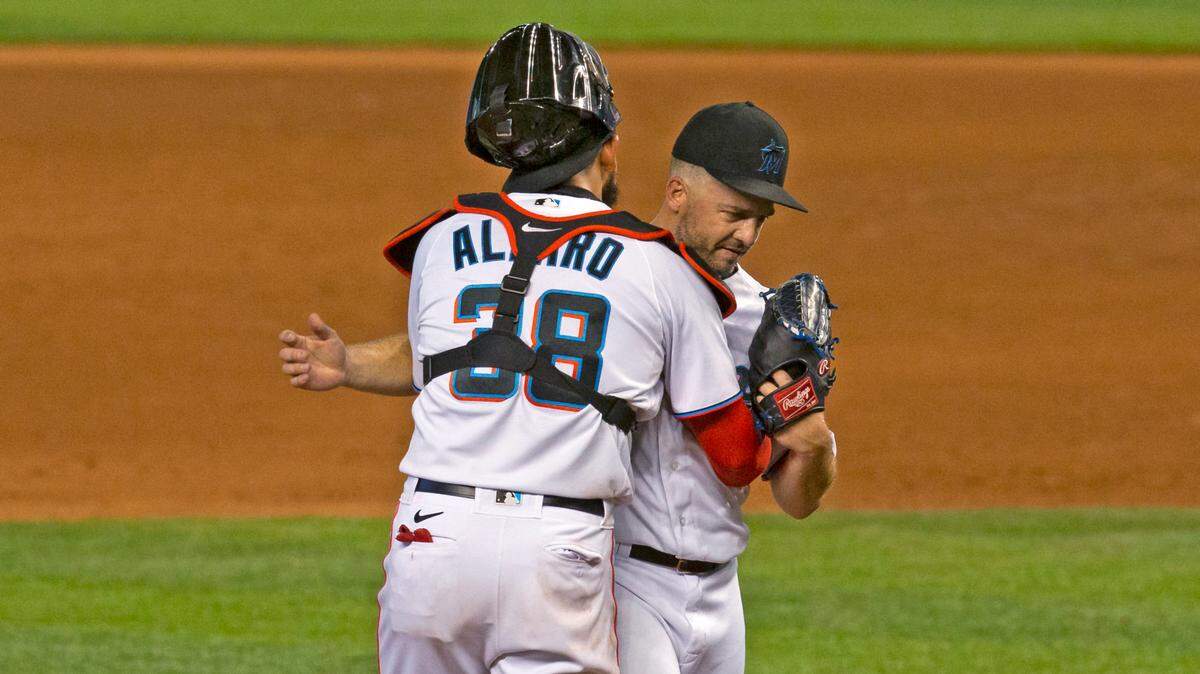 Miami Marlins pitcher Brandon Kintzler (27) celebrates with catcher Jorge Alfaro (38) after their 2-1 win over the Washington Nationals in the first game of a baseball doubleheader at Marlins Park in Miami on Sunday, September 20, 2020.