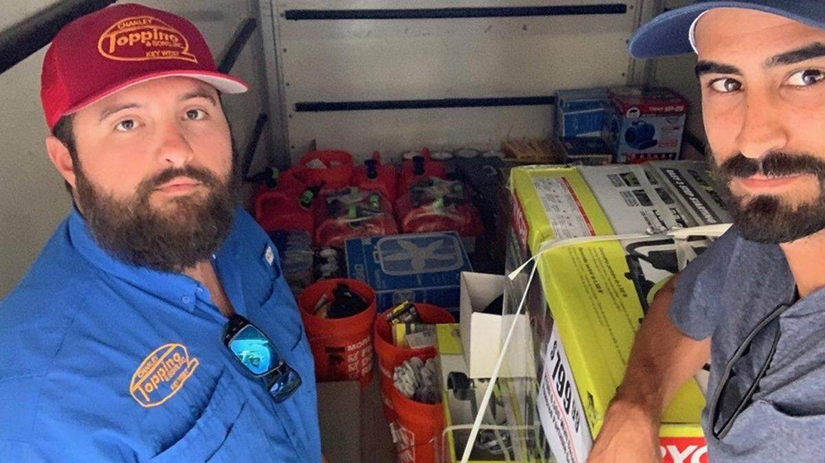 Andrew Toppino and Robert Spottswood Jr., of Key West, stand with a load of supplies destined for the people of the Bahamas, specifically Green Turtle Cay, which is Key West’s sister city.