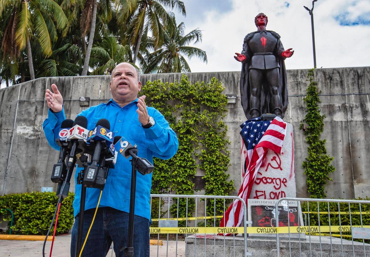 Evelio Medina, President, CEO & Founder at Downtown Miami & Brickell Chamber of Commerce speaks in front of the defaced statue of Christopher Columbus on Friday, June 12, 2020 about this SundayÕs upcoming Law and Order Rally at Bayfront Park.