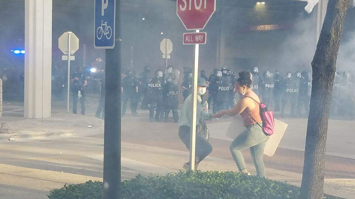 LaToya Ratlieff was being led away from tear gas by another marcher at an anti-police brutality protest in Fort Lauderdale May 31. Moments after this photo was taken a police officer shot her in the face with a foam rubber bullet, fracturing her right eye socket.