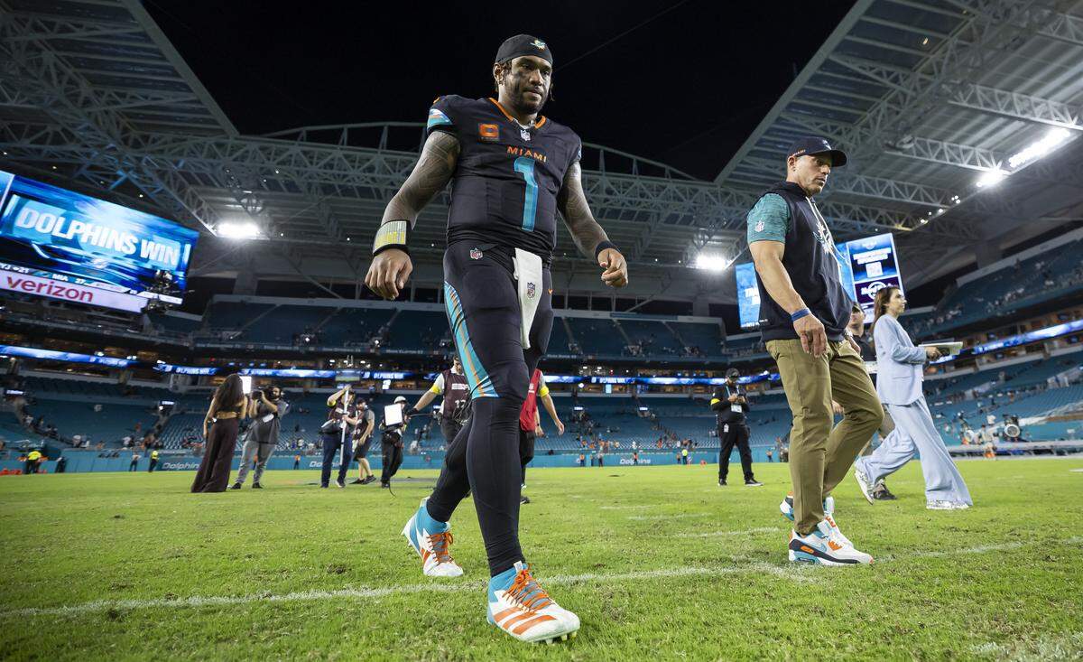 Miami Dolphins quarterback Tua Tagovailoa (1) walks off the field after his NFL game against the New York Jets at Hard Rock Stadium on Monday, Sept. 29, 2025, in Miami Gardens, Fla.