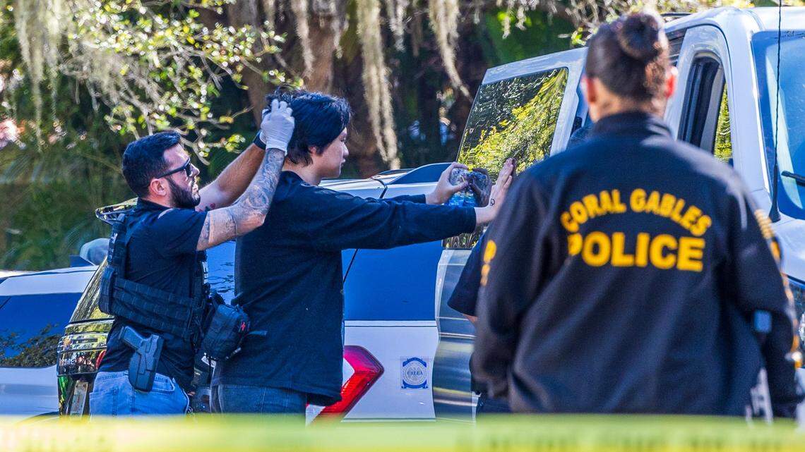Multiple law enforcement officers processed a group of illegal migrants and two suspected smugglers arrested at 11600 Old Cutler Road in Coral Gables early morning, on Tuesday, January 28, 2025.