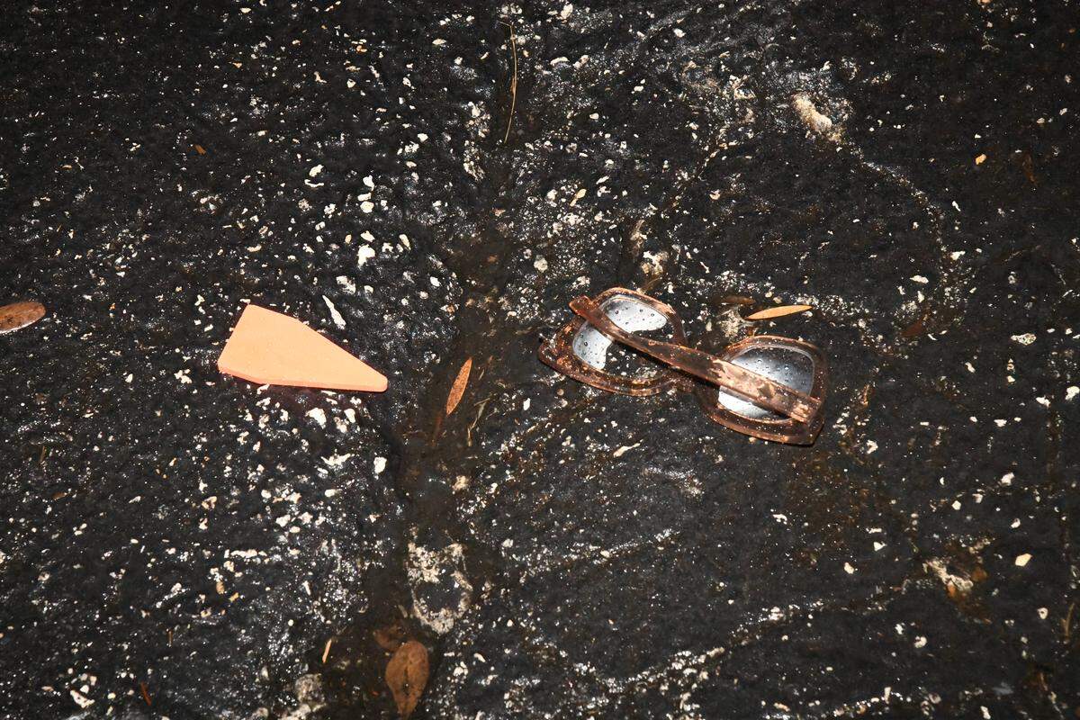 Broken glasses on the scene of April 10, 2023, meet up that ended in a shooting.