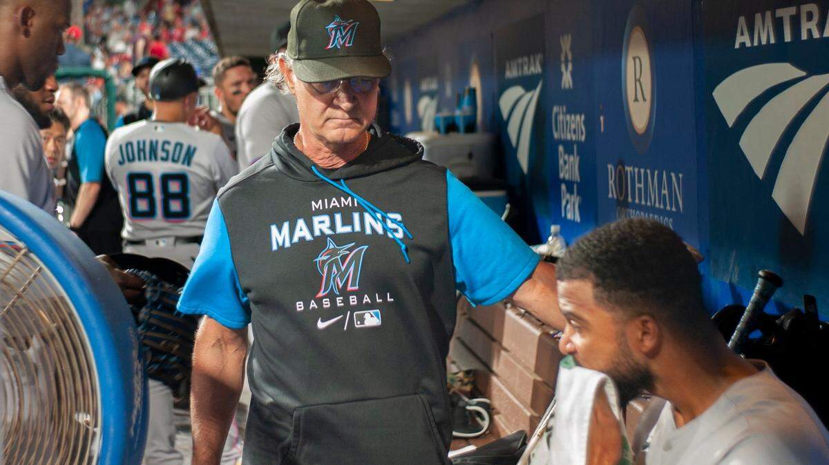Miami Marlins manager Don Mattingly talks to starting pitcher Sandy Alcantara (22) in the dugout during the seventh inning of a baseball game against the Philadelphia Phillies, Monday, June 13, 2022, in Philadelphia.