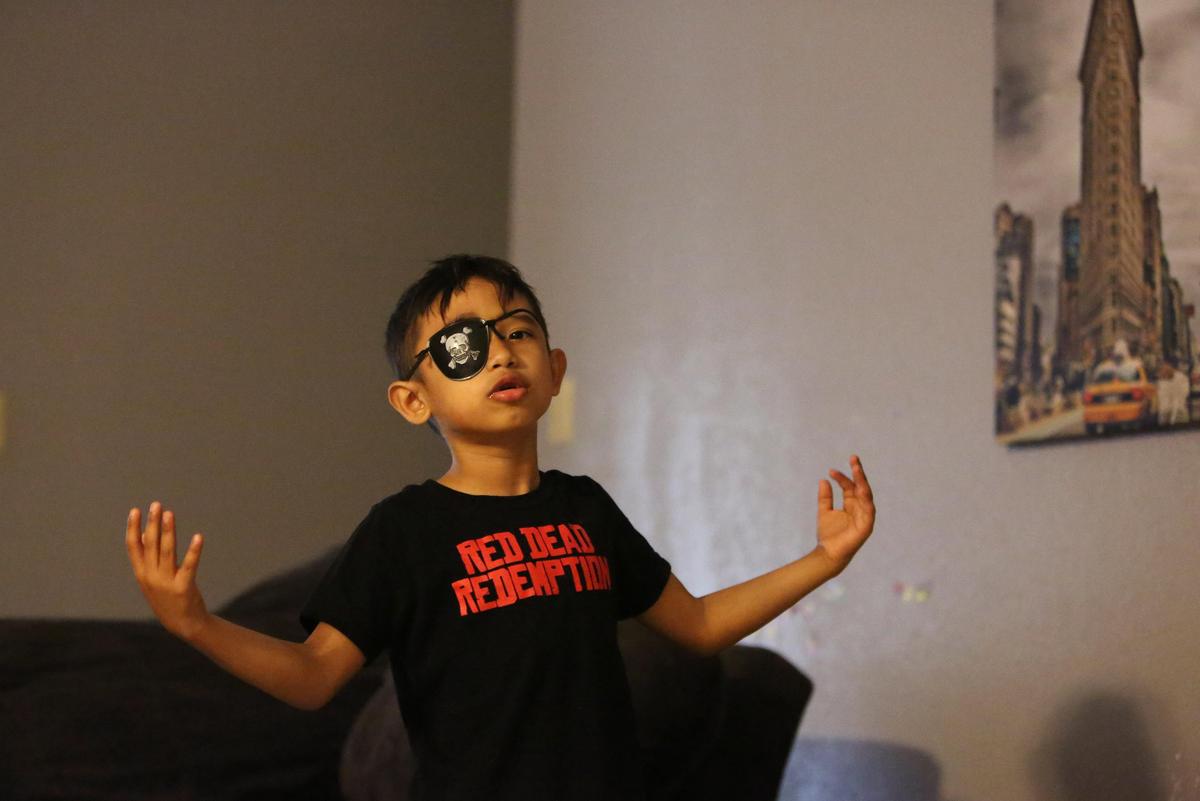 Julian Morales, 7, sings along to his favorite songs while wearing a toy pirate patch in his Homestead living room, Wednesday, Sept. 26, 2018. Julian has a rare genetic disorder and is in need of a bone marrow transplant. But finding a match has been a challenge. According to Be the Match, getting Hispanic donors isn’t easy.