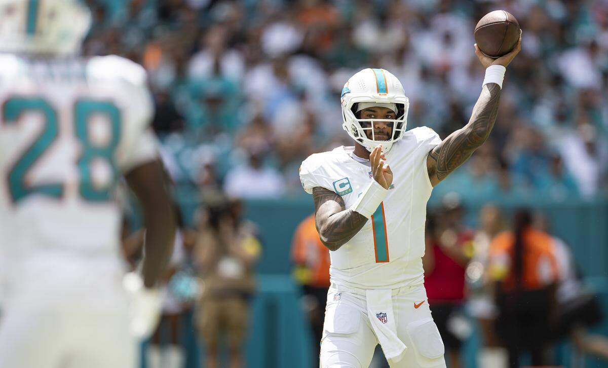 Miami Dolphins quarterback Tua Tagovailoa (1) throws the ball in the first half of his NFL game against the New England Patriots at Hard Rock Stadium on Sunday, Sept. 14, 2025, in Miami Gardens, Fla.