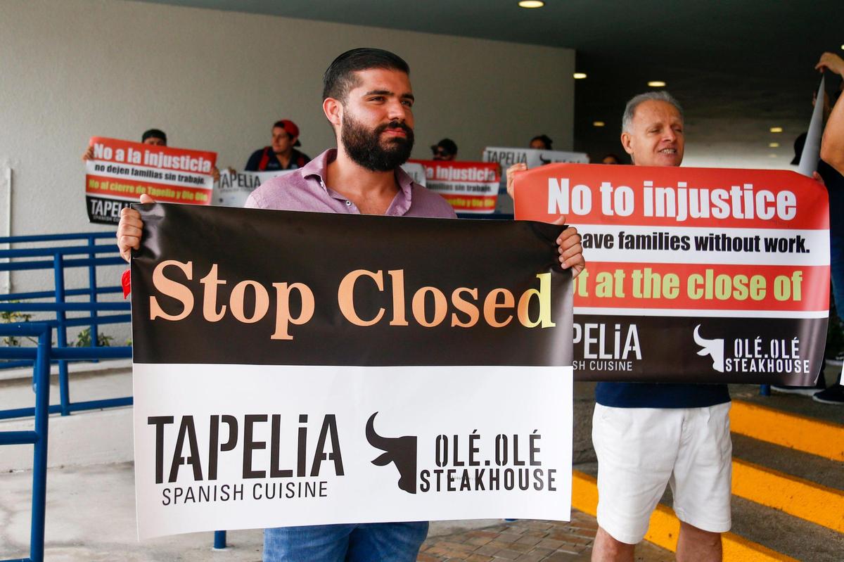 Igor Nebola, manager at Ole Ole Steakhouse in Lincoln Road in Miami Beach, protests with others outside Miami Beach City Hall on Nov. 22, 2021, after the city denied the renewal of the restaurant’s outdoor dining permit in Miami Beach.