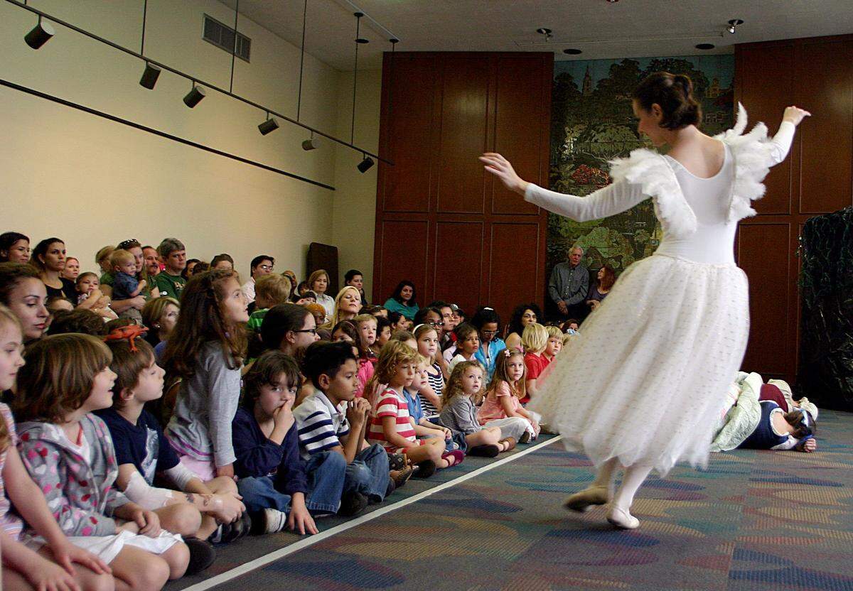 Barbie Freeman from the Momentum Dance Company acts as the Angel during a performance of Hansel and Gretel at the Coral Gables Library on Saturday, Feb. 4, 2012. The library on Segovia Street is the site of many cultural events.