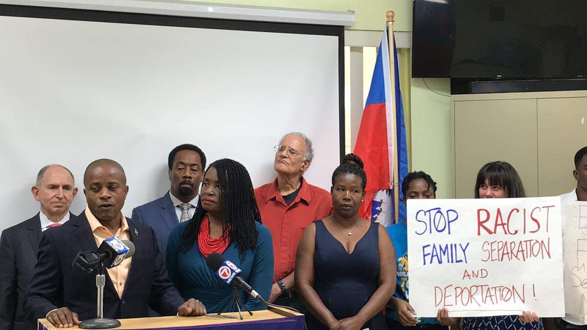 South Florida Haitian activists make views known on Trump immigration policy. Front row, from left: Attorney and former North Miami Mayor Andre Pierre, activist Marleine Bastien and Haitian Family Reunification Parole program recipient Roseline Desruisseaux. Back row, from left: Lawyers Ira Kurzban, Clarel Cyriaque and Steve Forester.