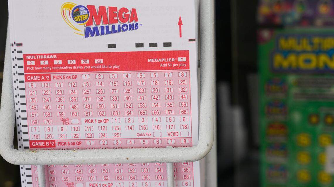 Mega Millions lottery slips are displayed, Wednesday, Jan. 11, 2023, in New York. The Mega Millions prize has grown again to an estimated $1.35 billion after there was no winner of the lottery’s latest giant jackpot.