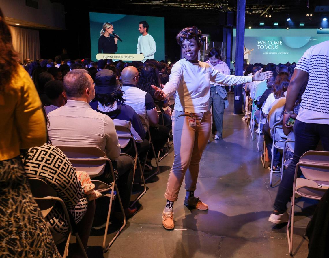 A VOUS volunteer welcomes congregants in Miami Gardens during Palm Sunday service. VOUS opened their fourth location in January 2024 and continues to thrive in a era when many legacy churches are struggling to attract members.
