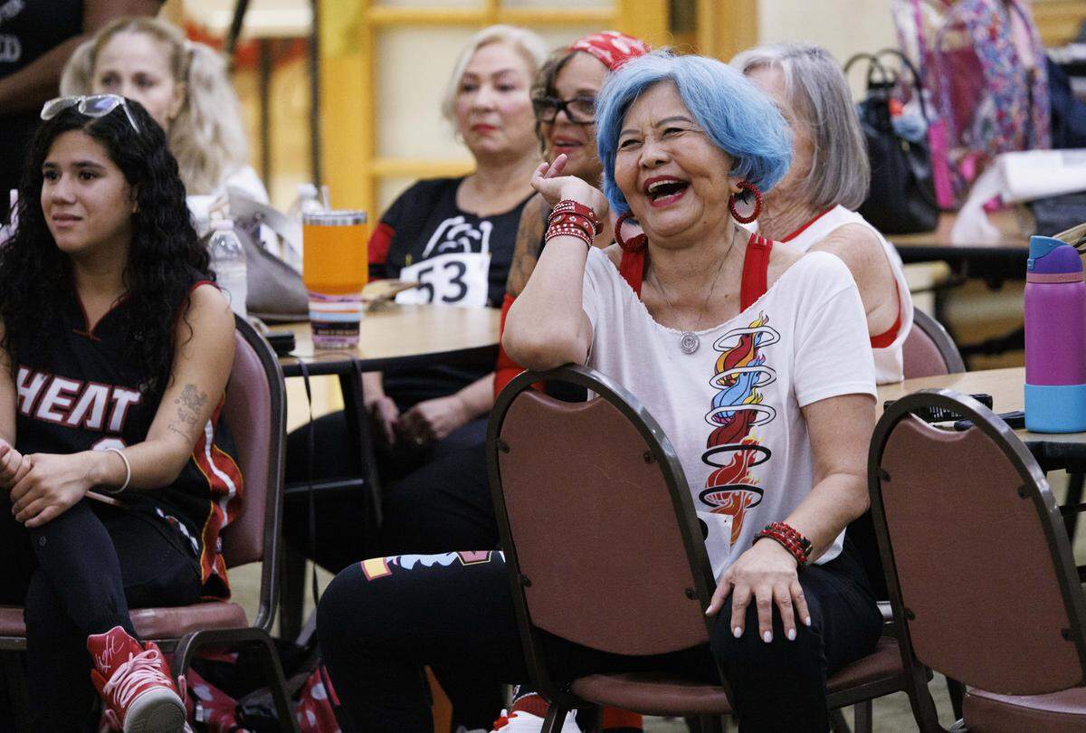 Paula Liu smiles while participants introduce themselves dances during the HEAT Golden Oldies auditions for the Miami Heat senior dance team on Thursday, Sept. 25, 2025, at Southwest Focal Point Community Center in Pembroke Pines, Fla.
