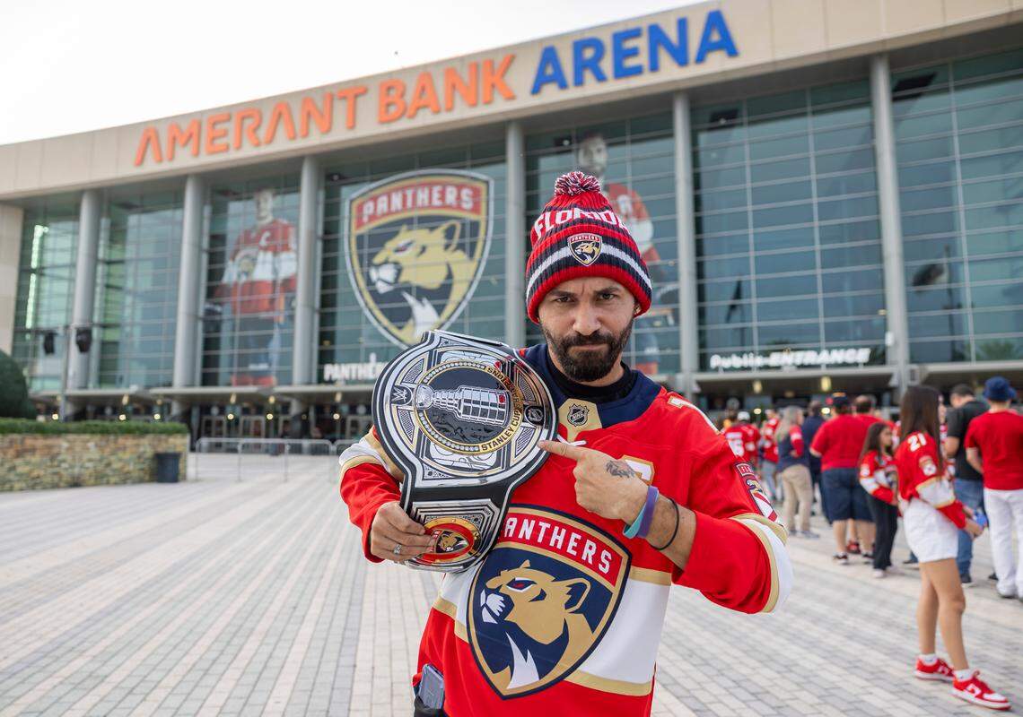 Florida Panthers fan Diego Santana holds championship belt as he arrives to a watch party at the Amerant Bank Arena before his team plays against the Edmonton Oilers in Game 1 of the NHL Stanley Cup Final on Wednesday, June 4, 2025, in Sunrise, Fla.