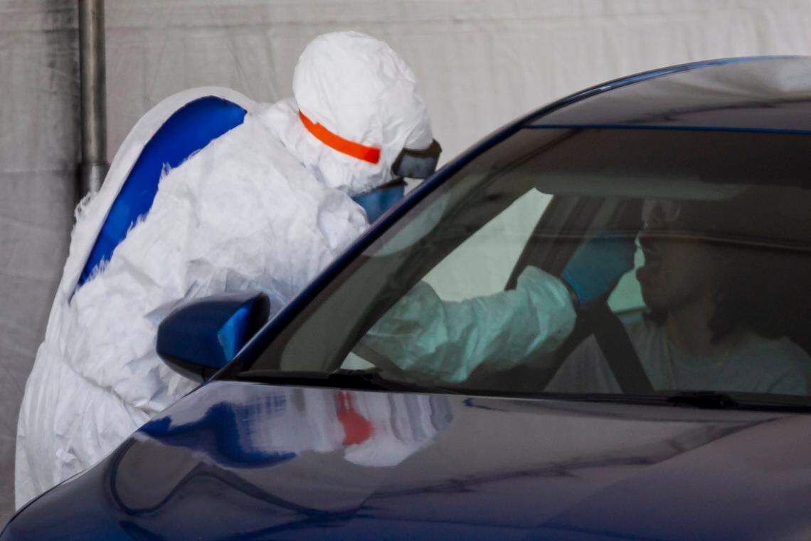 A COVID-19 drive-thru center operates near Marlins Park in Miami’s Little Havana neighborhood on Monday, June 29, 2020.