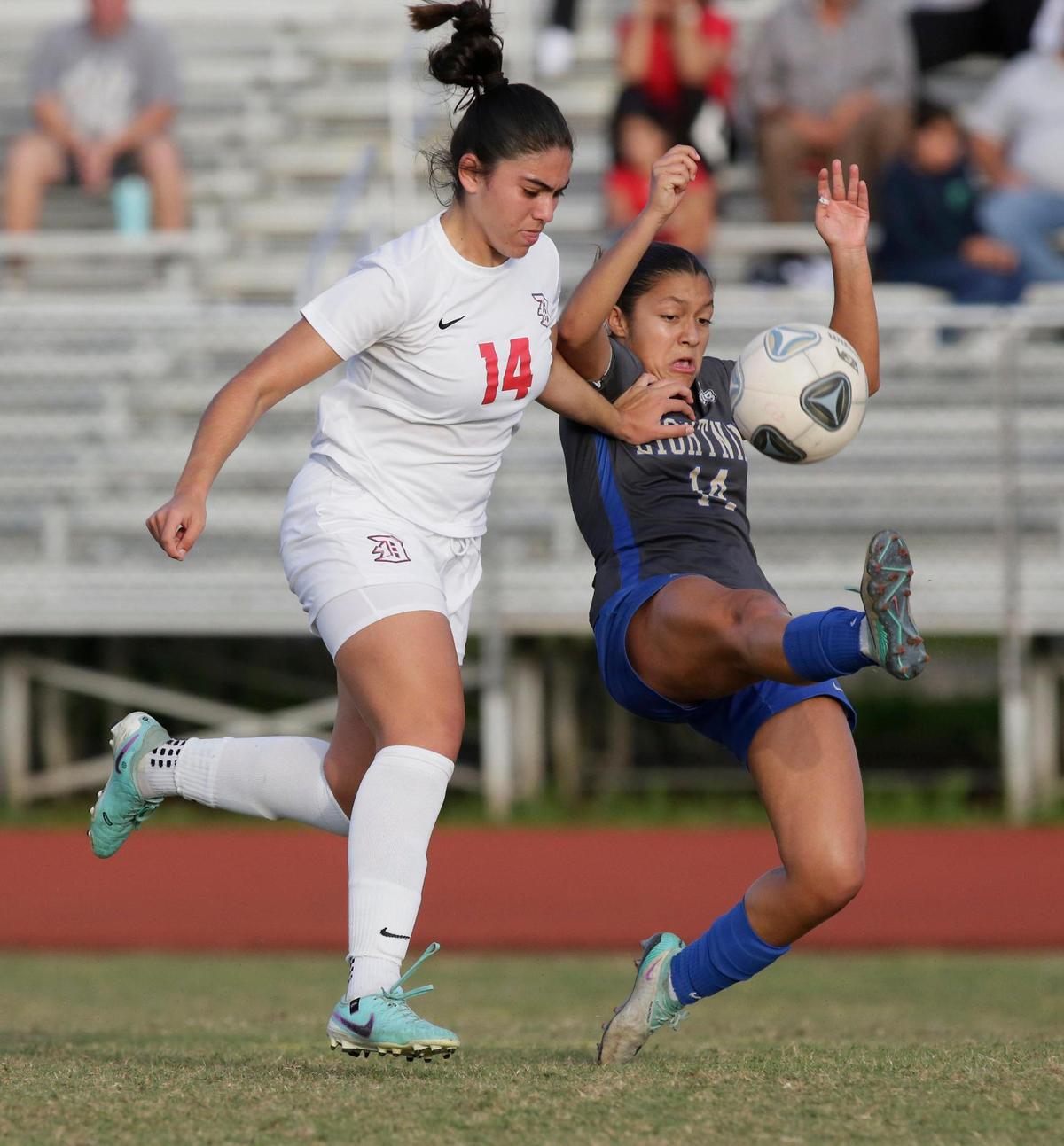 Cypress Bay Lightning Gabriela Ferreer (14) and Doral Firebirds Rachel Brown (14) fight for the ball during Region 4-7A Girls Soccer semifinal game on Friday, February 16, 2024 at Cypress Bay HS in Weston. Andrew Uloza / for Miami Herald