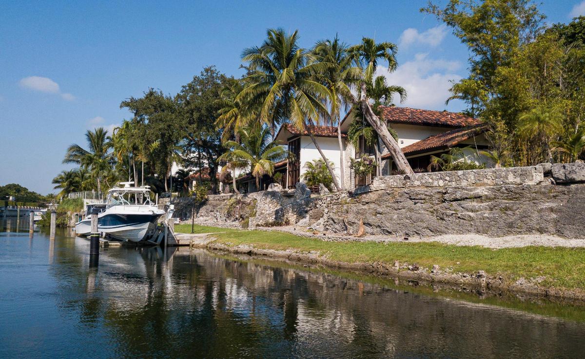 A view of a home near Cocoplum Plaza Circle on Monday, Dec. 12, 2022, in Miami, Florida. The home is located near one of Miami-Dade County’s highest points of elevation.