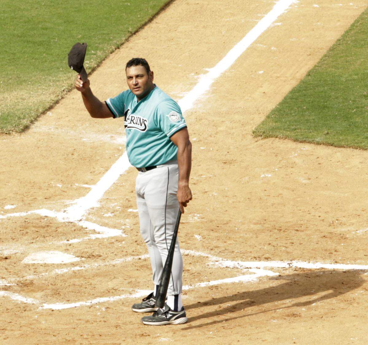 Orestes Destrade, Coral Park's first baseman in 1978 and a member of the Florida Marlins 1993 inaugural season, acknowledges an appreciative crowd attending the 24th annual Joe DiMaggio Legends Game in 2012.
