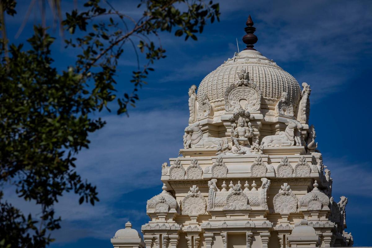 An ornate tower that rises over the inner sanctum, known as a Vimana, at the Shiva Vishnu Temple of South Florida. The traditional South Indian Hindu Temple attracts visitors from far and wide for its religious festivals each year.