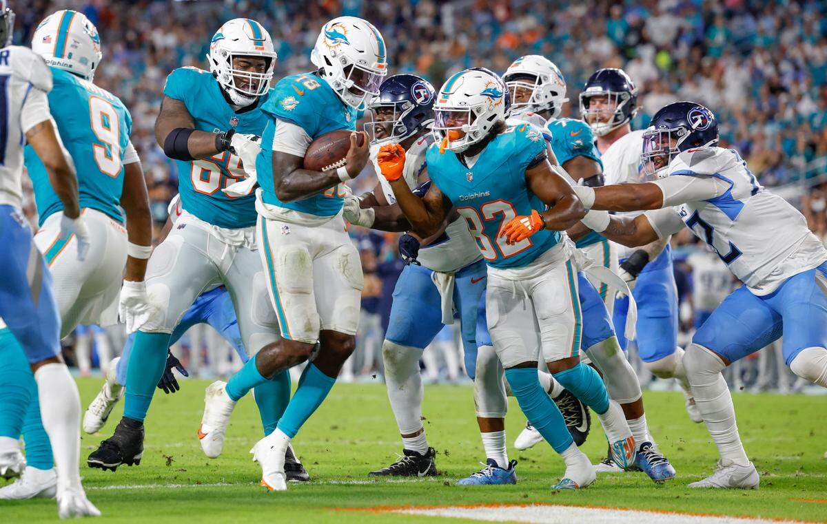 Miami Dolphins quarterback Tyler Huntley (18) on a quarterback keep to score against the Tennessee Titans in the second half of their NFL game at Hard Rock Stadium on Monday, September 30, 2024, in Miami Gardens, Fla. 