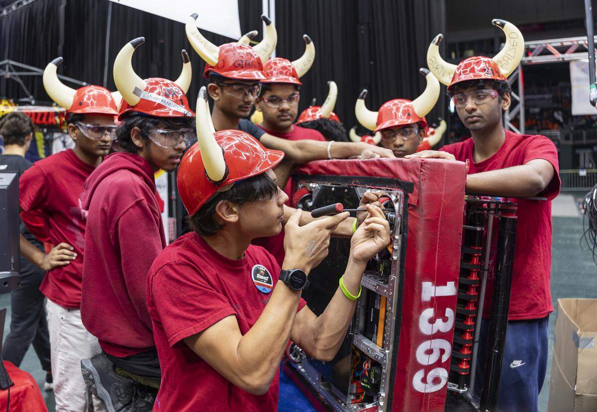 Middleton High School student Anderson Sears, 16, a member of Minotaur, works on repairing a wheel on his team’s robot, Endeavor, as they prepare to compete in the 2026 FIRST Robotics South Florida Regional Competition at the University of Miami’s Watsco Center on Friday, April 10, 2026, in Coral Gables, Fla. Participants from local school districts, surrounding states, and international teams are competing for an opportunity to earn a spot at the 2026 FIRST World Championship.