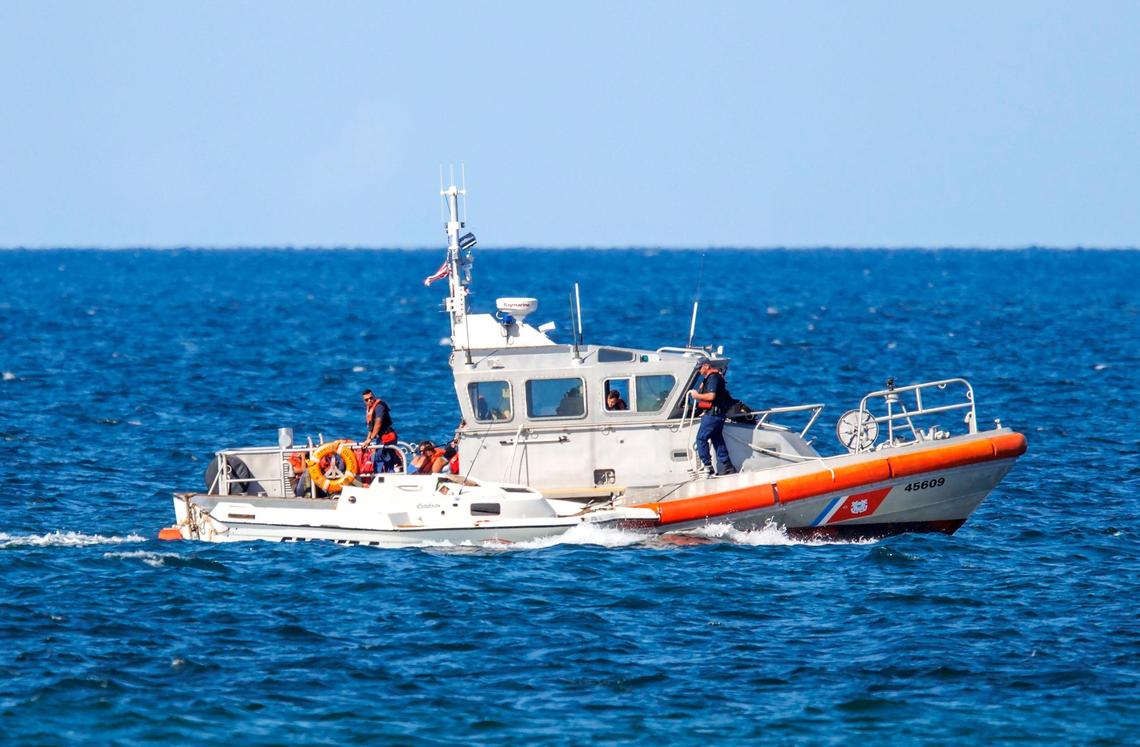 A U.S. Coast Guard a boat carrying migrants, at least some from Cuba, off the coast of Hollywood on Thursday, Sept. 1, 2022.