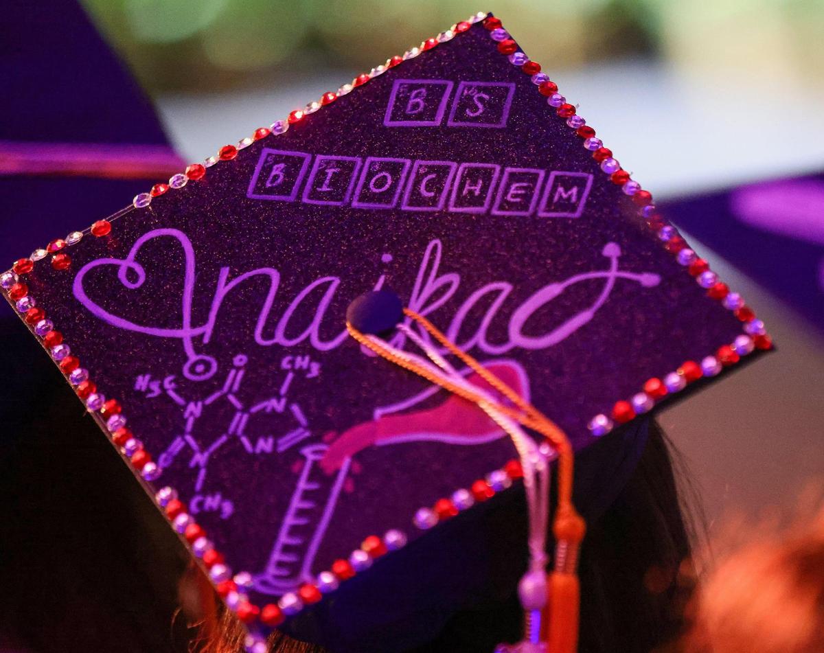 Naika Mildort, a member of the Honors College, got a bachelor’s in biochemistry because she dreams of becoming a doctor. The 20-year-old powered through college by getting some credits while still at Everglades High School in Miramar. She decorated her cap with her major and a cup of coffee to honor the best friend that helped her with her one-hour commute from her home in Broward to FIU nearly every day. “It was very draining, but I managed because I had coffee,” she said with a grin.