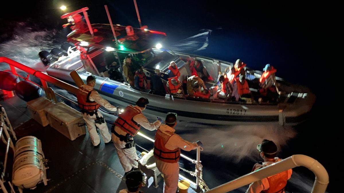 A U.S. Customs and Border Protection surface asset crew prepares to transfer interdicted Haitian migrants to the Coast Guard Cutter Charles Sexton crew on April 22, 2021, about 10 miles east of Lake Worth, Florida. The Coast Guard Cutter Charles Sexton’s crew repatriated 72 Haitian migrants to Haiti on April 27, 2021.