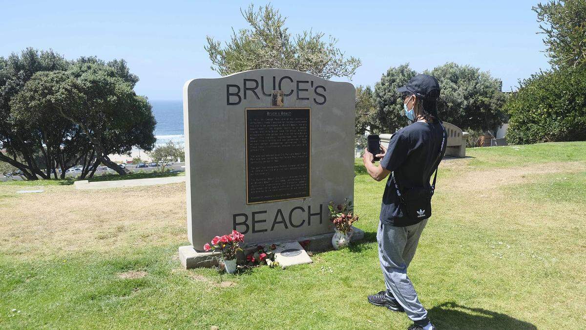 FILE - This April 8, 2021 file photo, shows a monument at Bruce’s Beach in Manhattan Beach, Calif.. Los Angeles County leaders took initial steps Tuesday, April 20, 2021, toward returning prime beachfront property to descendants of a Black couple who built a resort for African Americans but were stripped of the land by local city officials a century ago. (Dean Musgrove/The Orange County Register via AP, File)