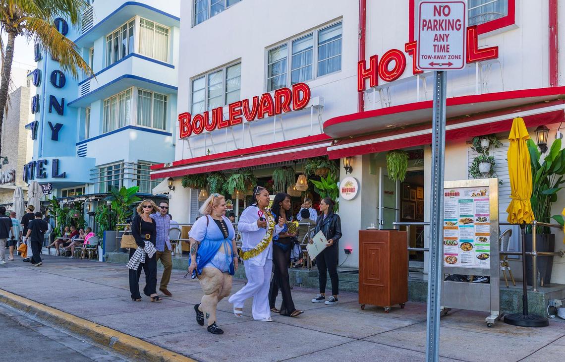 People make their way up Ocean Drive during spring break in Miami Beach, Florida, on Friday, March 21, 2025.
