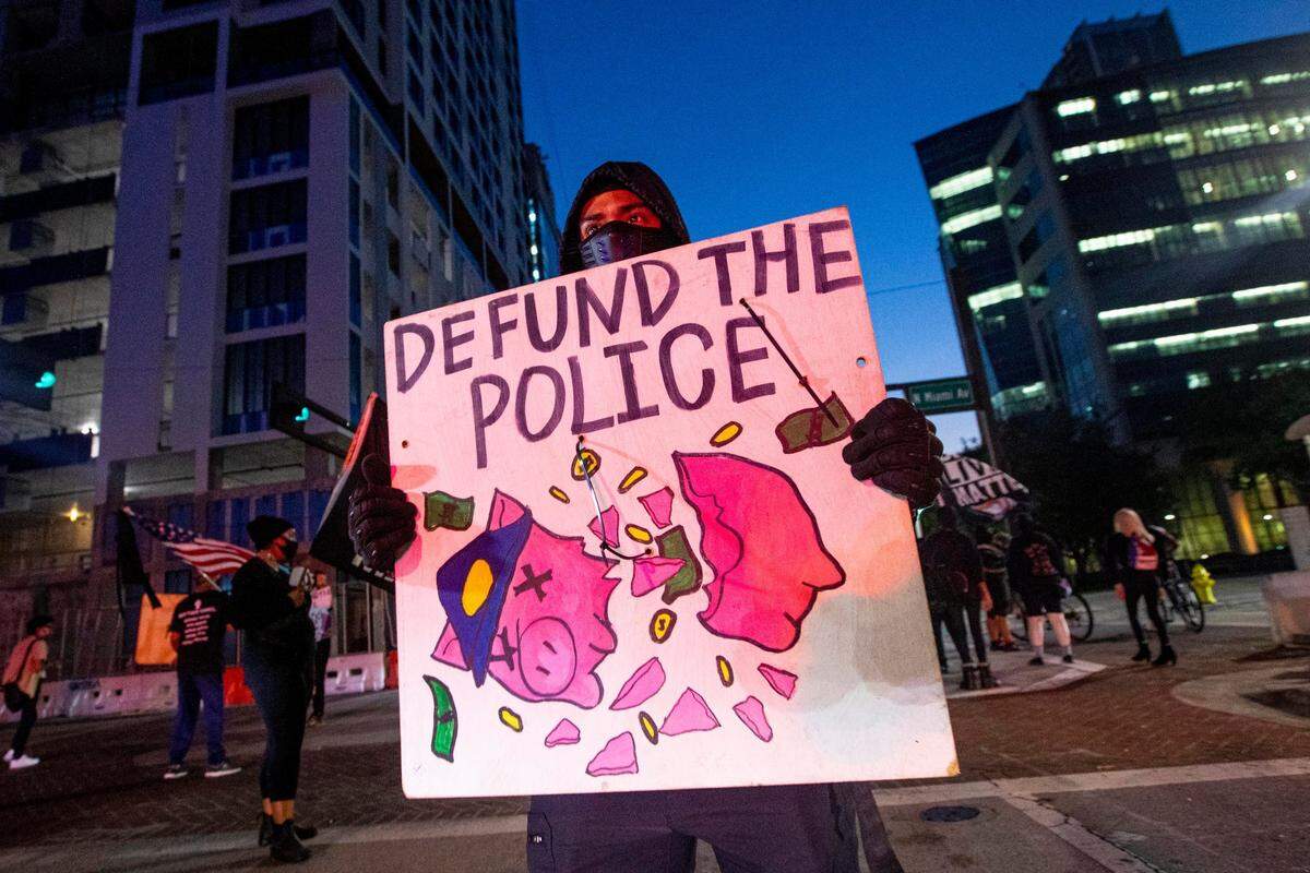 Protestors hold up traffic on Biscayne Boulevard and NE 1st Street during a protest by South Florida activists, to get justice for Ma’khia Bryant, who was killed by police in Columbus, Ohio, at the Simon Bolivar Monument in Downtown Miami, Florida, on Saturday, April 24, 2021.