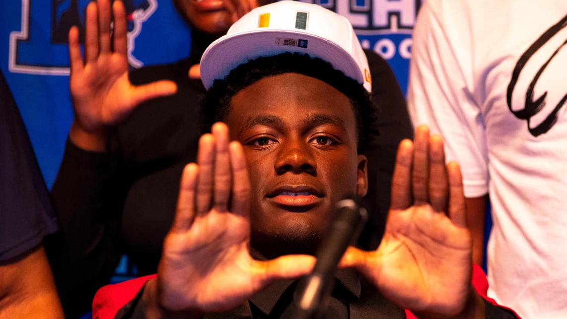 Four-star defensive lineman Nyjalik Kelly reacts by throwing up the ‘U’ after choosing to sign with University of Miami football during National Signing Day at Dillard High School in Fort Lauderdale, Florida, on Wednesday, December 15, 2021. Kelly made a recent decision to switch his school of choice from Oregon to Miami after the Hurricanes brought on Mario Cristobal as head coach.
